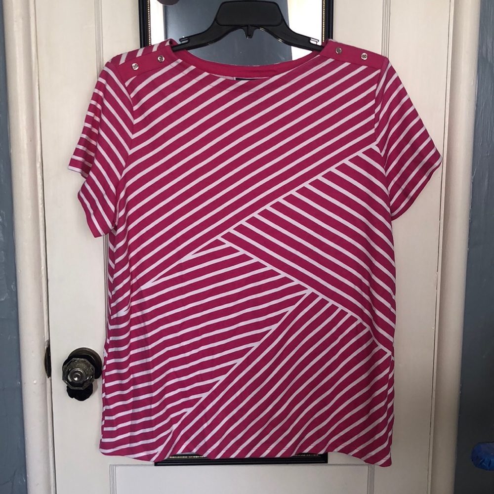 Pink and white striped shirt with fashionable buttons at the shoulders.